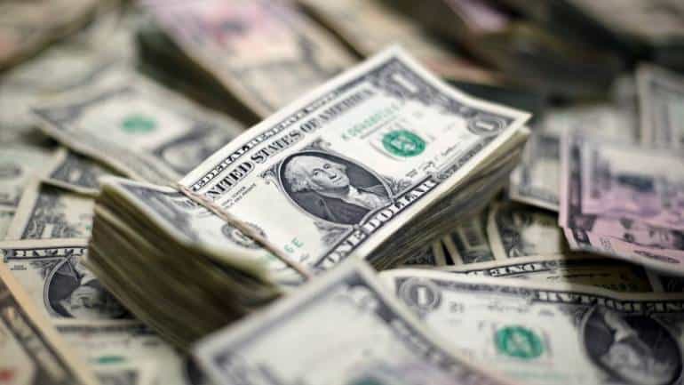 Dollar hits 1-year high as Fed tightening in focus, iron ore prices boost Aussie