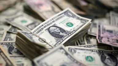 Dollar hits 1-year high as Fed tightening in focus, iron ore prices boost Aussie