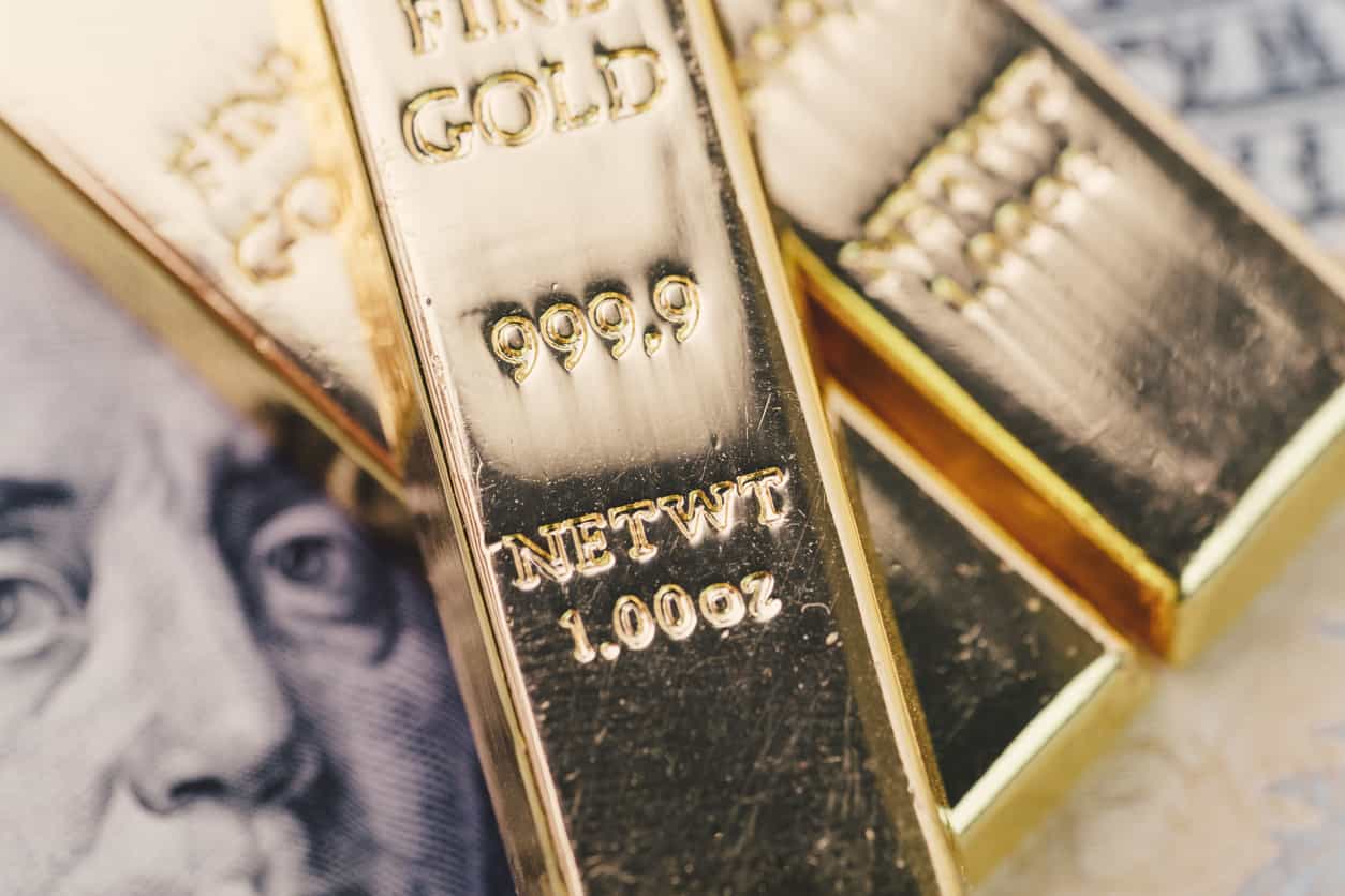 Gold eases from one-month high on firmer dollar, profit-taking