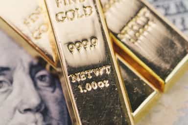 Gold eases from one-month high on firmer dollar, profit-taking